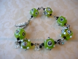GREEN WITH ENVY-- Wire wrapped funky green square lampwork beaded bracelet.